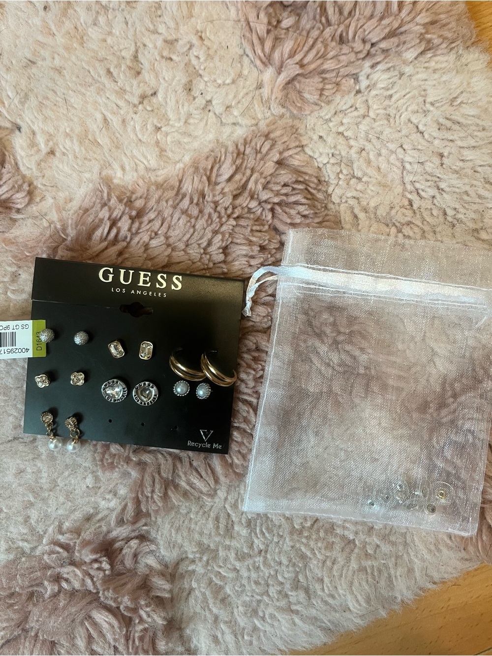 set of 7 guess earrings mixed metal gold and silver toned